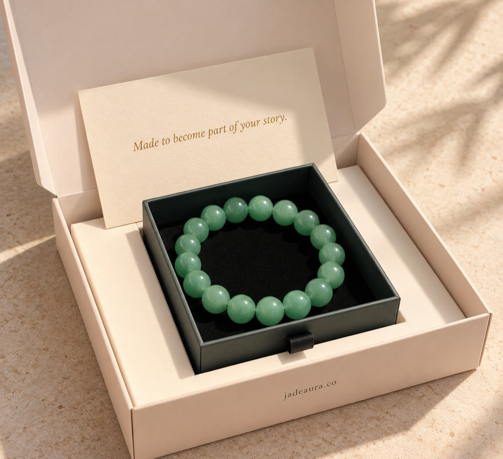 Complete open Jade Aura bracelet gift packaging with story card