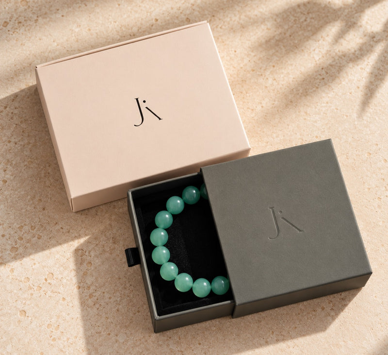 Jade Aura drawer bracelet box with blush outer packaging